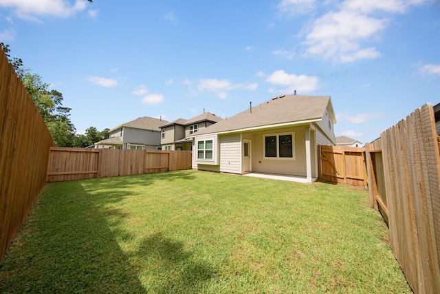 13228 Musky Dr, Conroe, TX 77384 - back of property featuring a fenced backyard and a patio area