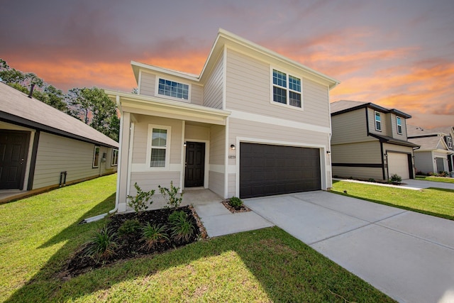 13228 Musky Dr, Conroe, TX 77384 - traditional-style home featuring a garage, driveway, and a front lawn