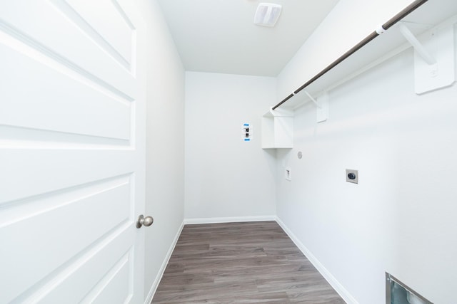 13228 Musky Dr, Conroe, TX 77384 - laundry room featuring hookup for an electric dryer, light wood-type flooring, hookup for a gas dryer, and washer hookup