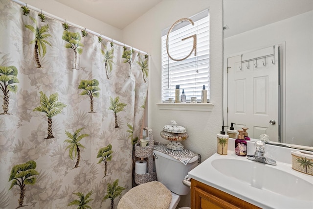 986 Tuna Dr, Crystal Beach, TX 77650 - bathroom with vanity, toilet, and curtained shower