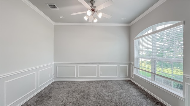 14227 Angelina Dr, Baytown, TX 77523 - spare room featuring healthy amount of natural light, carpet flooring, a ceiling fan, crown molding, and wainscoting