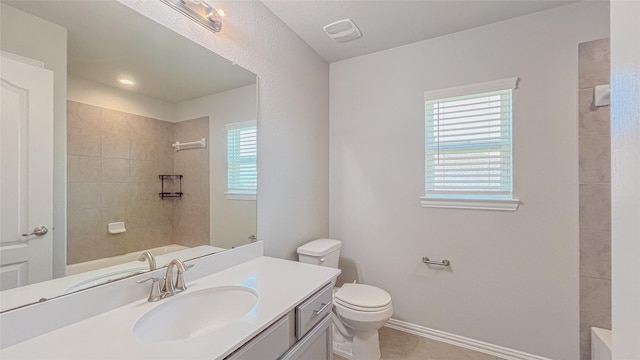 14227 Angelina Dr, Baytown, TX 77523 - bathroom with toilet, vanity, a shower, and baseboards