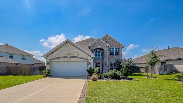 14227 Angelina Dr, Baytown, TX 77523 - view of front facade with driveway, an attached garage, brick siding, and stone siding