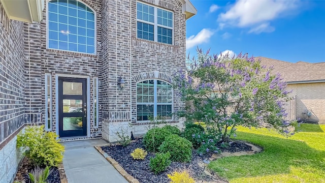 14227 Angelina Dr, Baytown, TX 77523 - entrance to property with a yard, stone siding, and brick siding