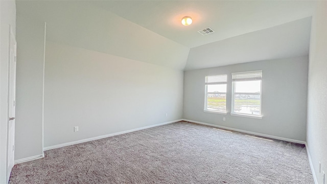 14227 Angelina Dr, Baytown, TX 77523 - carpeted spare room with baseboards and vaulted ceiling