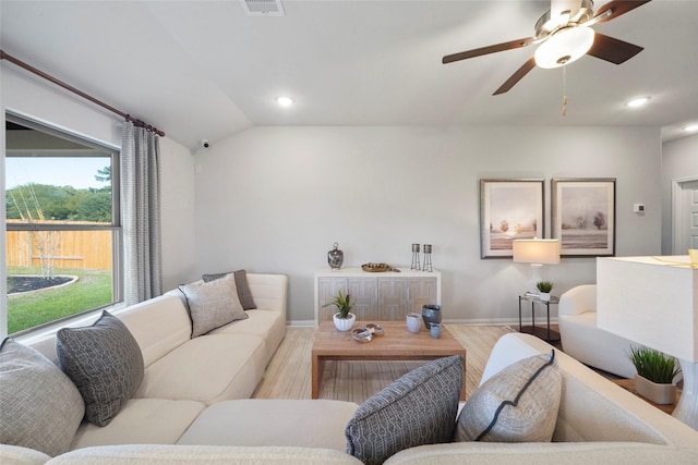 11608 Whirlaway Dr, Willis, TX 77318 - living room featuring wood finished floors, baseboards, vaulted ceiling, ceiling fan, and recessed lighting
