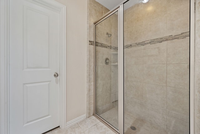 19823 Sonterra Ln, Richmond, TX 77407 - full bath with a stall shower, baseboards, and tile patterned floors