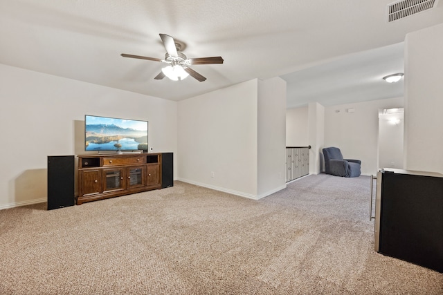 19823 Sonterra Ln, Richmond, TX 77407 - unfurnished living room with light colored carpet, ceiling fan, and baseboards