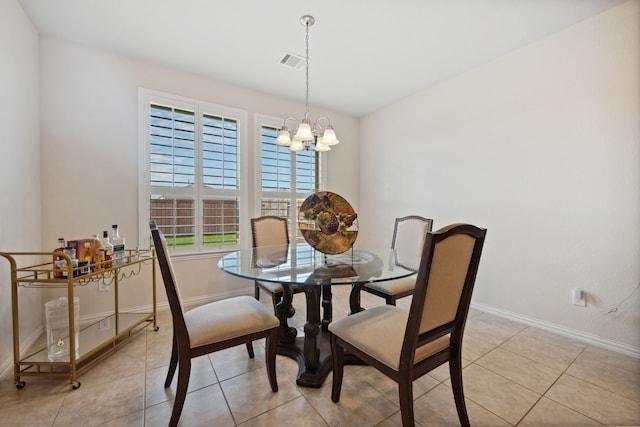19823 Sonterra Ln, Richmond, TX 77407 - dining area with light tile patterned floors, baseboards, and a chandelier