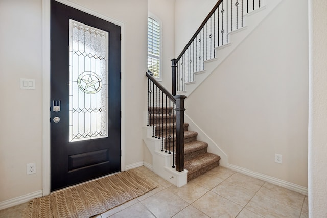 19823 Sonterra Ln, Richmond, TX 77407 - entrance foyer with stairs, light tile patterned flooring, and baseboards