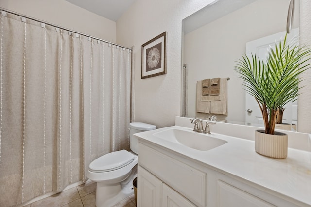 19823 Sonterra Ln, Richmond, TX 77407 - bathroom with toilet, vanity, and tile patterned floors
