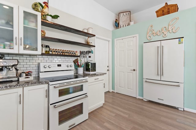 17322 Camberwell Green Ln, Houston, TX 77070 - kitchen featuring white appliances, decorative backsplash, open shelves, and white cabinets