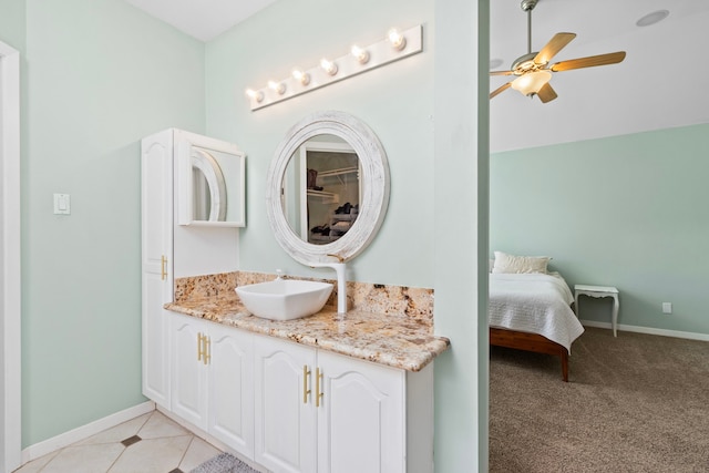 17322 Camberwell Green Ln, Houston, TX 77070 - bathroom with vanity, baseboards, and ceiling fan