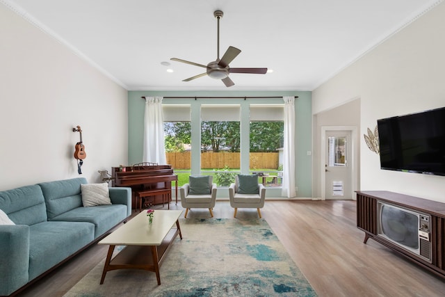 17322 Camberwell Green Ln, Houston, TX 77070 - living room featuring ornamental molding, a ceiling fan, wood finished floors, recessed lighting, and baseboards
