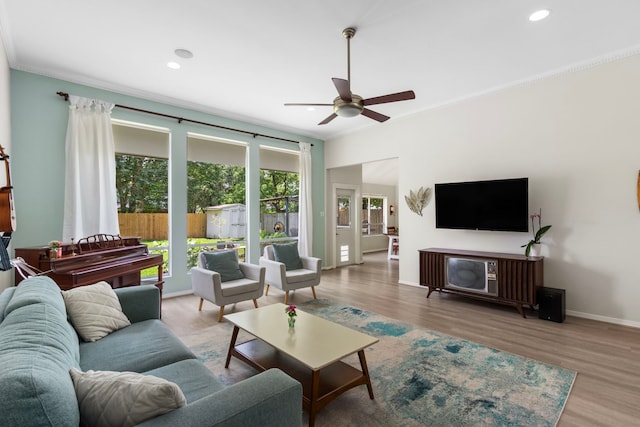 17322 Camberwell Green Ln, Houston, TX 77070 - living area featuring ceiling fan, crown molding, wood finished floors, baseboards, and recessed lighting