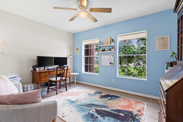 17322 Camberwell Green Ln, Houston, TX 77070 - home office featuring plenty of natural light, a ceiling fan, wood finished floors, and baseboards