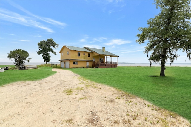 245 Bridgewater, Onalaska, TX 77360 - view of property exterior featuring driveway, a lawn, a water view, and a porch