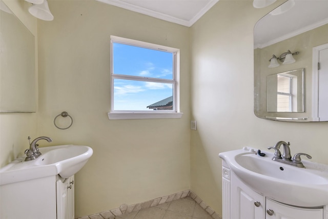 245 Bridgewater, Onalaska, TX 77360 - bathroom with two vanities, tile patterned flooring, crown molding, and baseboards
