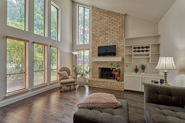 52 S Havenridge Dr, The Woodlands, TX 77381 - living room with a fireplace, dark wood-type flooring, and high vaulted ceiling