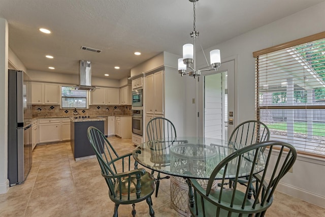 52 S Havenridge Dr, The Woodlands, TX 77381 - dining space featuring a chandelier, baseboards, and recessed lighting