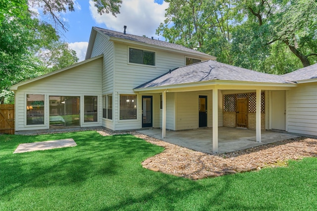 52 S Havenridge Dr, The Woodlands, TX 77381 - back of house with a patio and roof with shingles