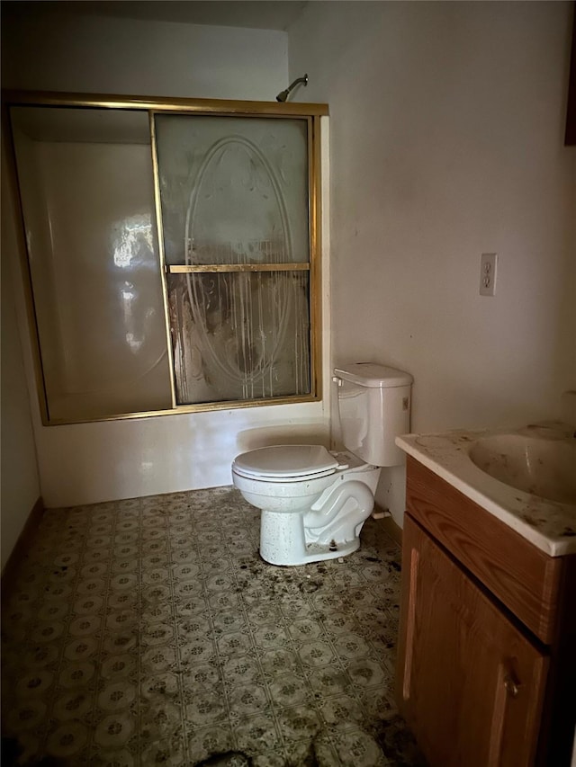 1883 Winding Creek Dr, Trinity, TX 75862 - bathroom with vanity, shower / bath combination with glass door, and toilet