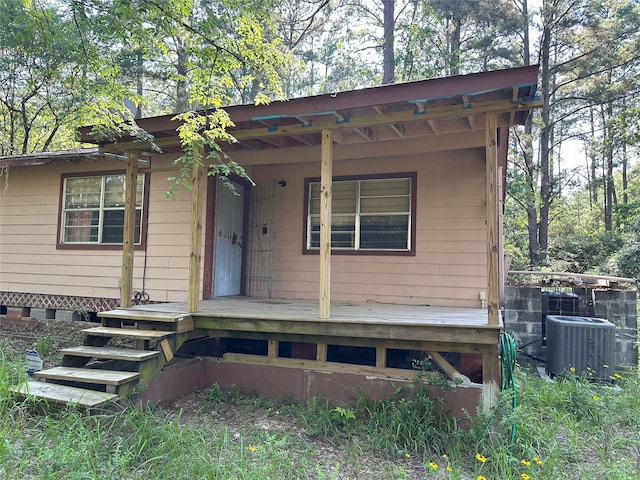 1883 Winding Creek Dr, Trinity, TX 75862 - view of front of home with cooling unit and a porch