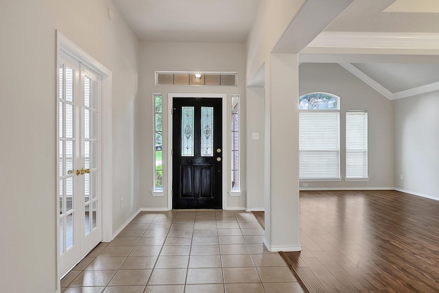 9927 Barr Lake Dr, Houston, TX 77095 - foyer entrance featuring french doors, baseboards, and wood finished floors