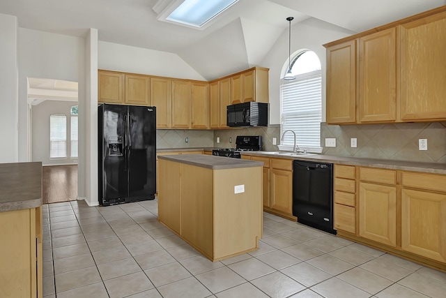 9927 Barr Lake Dr, Houston, TX 77095 - kitchen with black appliances, light brown cabinetry, lofted ceiling, light tile patterned floors, and a center island