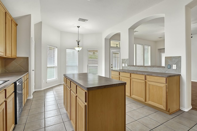 9927 Barr Lake Dr, Houston, TX 77095 - kitchen with healthy amount of natural light, dark countertops, and decorative backsplash