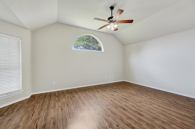 9927 Barr Lake Dr, Houston, TX 77095 - spare room with vaulted ceiling, wood finished floors, ceiling fan, and baseboards
