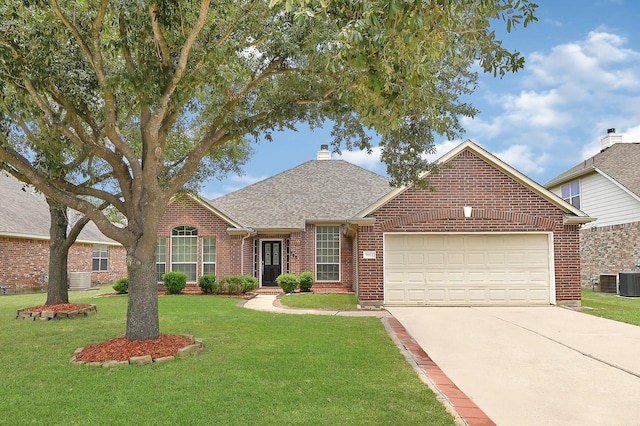 9927 Barr Lake Dr, Houston, TX 77095 - traditional-style home featuring brick siding, a garage, concrete driveway, a front lawn, and a shingled roof