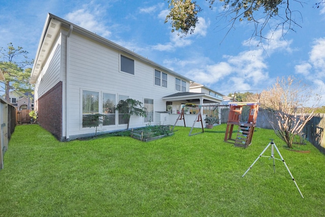 10138 Bayou Manor Ln, Houston, TX 77064 - rear view of house with a playground, a gazebo, and brick siding