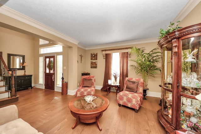 10138 Bayou Manor Ln, Houston, TX 77064 - living area featuring stairway, ornamental molding, wood finished floors, and baseboards