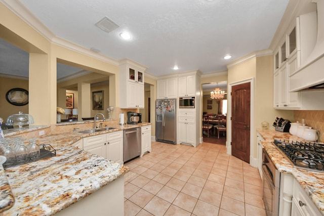 10138 Bayou Manor Ln, Houston, TX 77064 - kitchen featuring appliances with stainless steel finishes, a sink, custom range hood, light stone countertops, and light tile patterned flooring