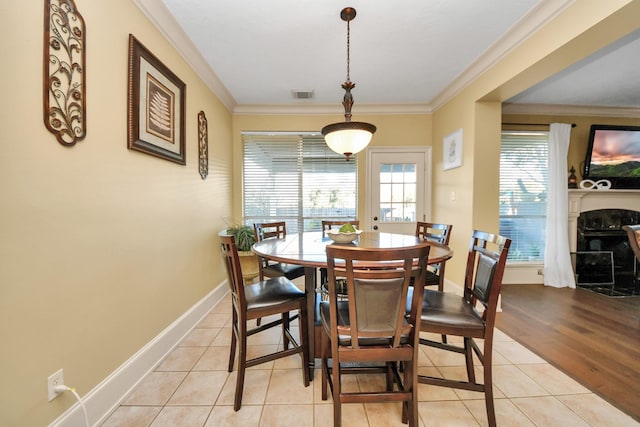 10138 Bayou Manor Ln, Houston, TX 77064 - dining space with ornamental molding, light tile patterned floors, and baseboards