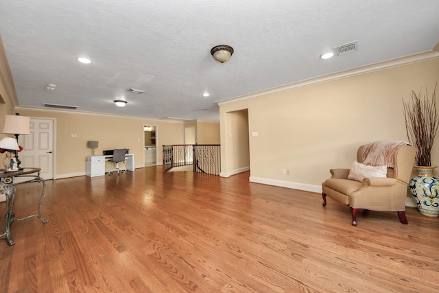 10138 Bayou Manor Ln, Houston, TX 77064 - unfurnished room featuring ornamental molding, an upstairs landing, a desk, baseboards, and light wood-style flooring