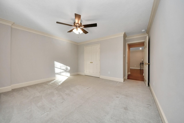 10138 Bayou Manor Ln, Houston, TX 77064 - unfurnished bedroom with ornamental molding, light colored carpet, baseboards, and a ceiling fan