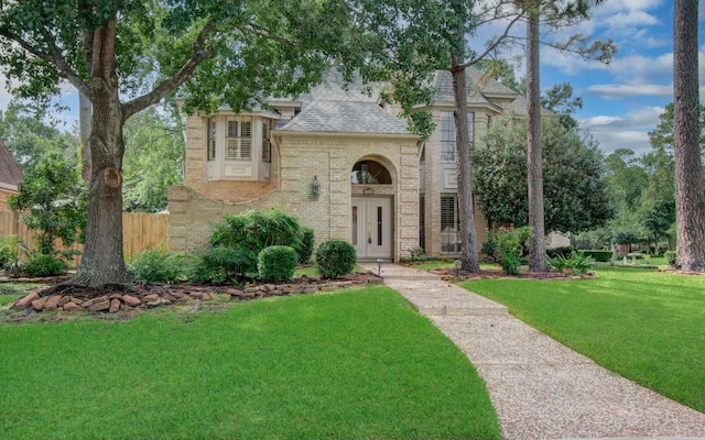 5810 Springton Ln, Spring, TX 77379 - english style home featuring brick siding and a shingled roof