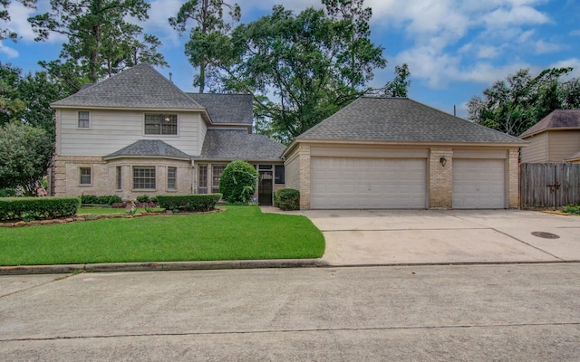 5810 Springton Ln, Spring, TX 77379 - view of front of home featuring brick siding, concrete driveway, a garage, and a shingled roof