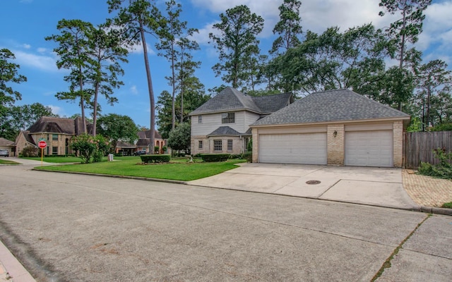 5810 Springton Ln, Spring, TX 77379 - view of front of home featuring brick siding, driveway, an attached garage, and roof with shingles