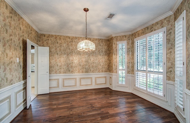 5810 Springton Ln, Spring, TX 77379 - unfurnished dining area featuring wallpapered walls, dark wood finished floors, wainscoting, a chandelier, and crown molding