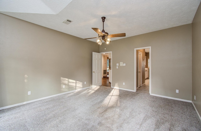 5810 Springton Ln, Spring, TX 77379 - unfurnished bedroom with carpet floors, baseboards, ensuite bath, a ceiling fan, and a textured ceiling