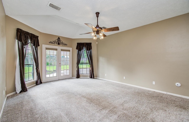 5810 Springton Ln, Spring, TX 77379 - carpeted spare room with baseboards, french doors, a ceiling fan, and a textured ceiling