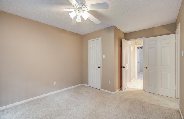 5810 Springton Ln, Spring, TX 77379 - unfurnished bedroom with a textured ceiling, carpet flooring, baseboards, a ceiling fan, and a closet