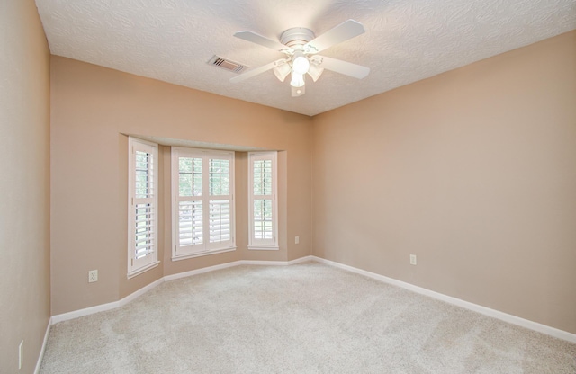 5810 Springton Ln, Spring, TX 77379 - empty room with carpet, a ceiling fan, baseboards, and a textured ceiling