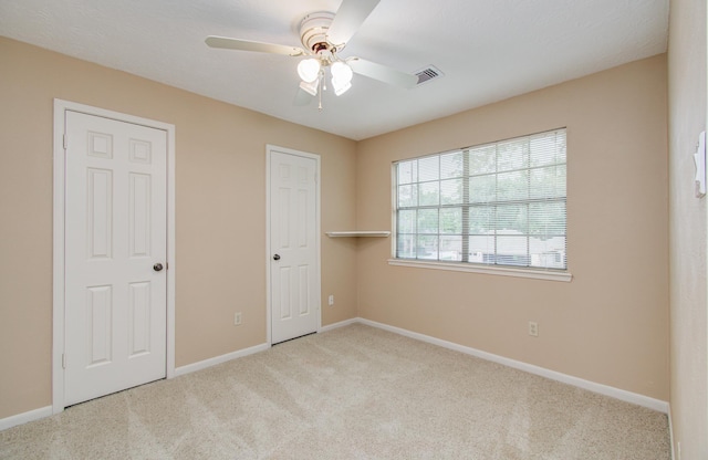 5810 Springton Ln, Spring, TX 77379 - unfurnished bedroom featuring carpet floors, baseboards, and ceiling fan