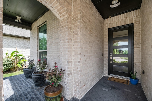 4818 Nodding Thistle Trl, Fulshear, TX 77441 - doorway to property with brick siding and covered porch