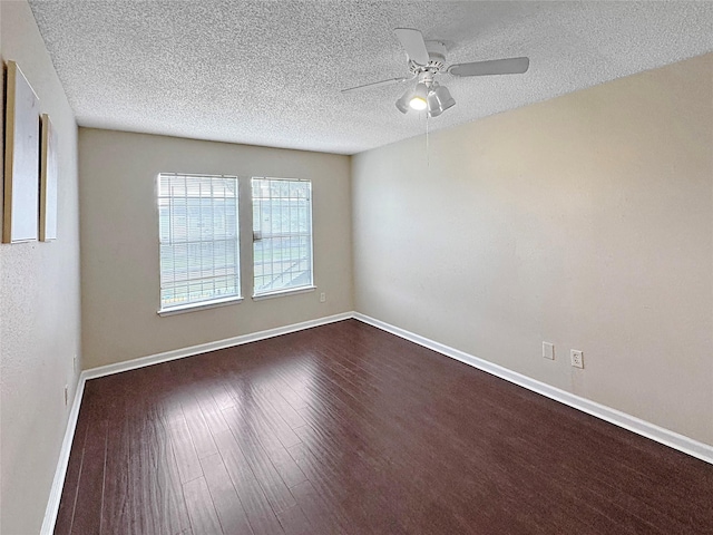 6328 W Airport Blvd Unit 6328, Houston, TX 77035 - spare room featuring a textured ceiling, ceiling fan, dark wood-style floors, and baseboards