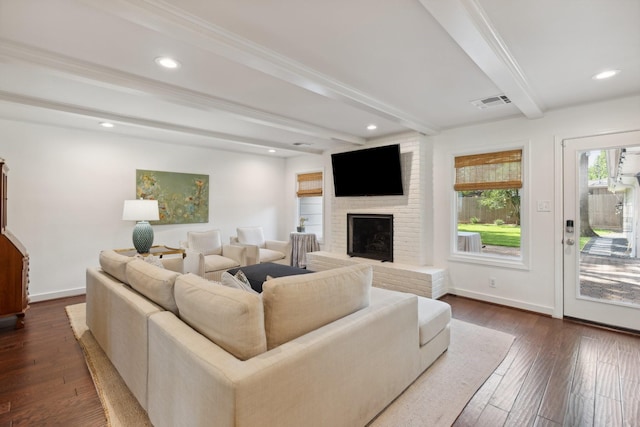 8019 Skyline Dr, Houston, TX 77063 - living area with a brick fireplace, beamed ceiling, dark wood finished floors, baseboards, and recessed lighting